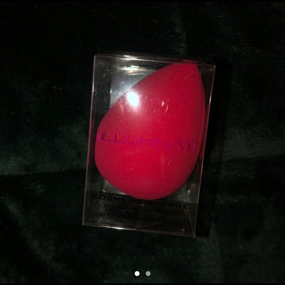 Hot pink cosmetic sponge.